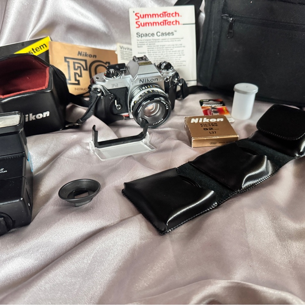 FG Nikon 35mm SLR camera with accessories
